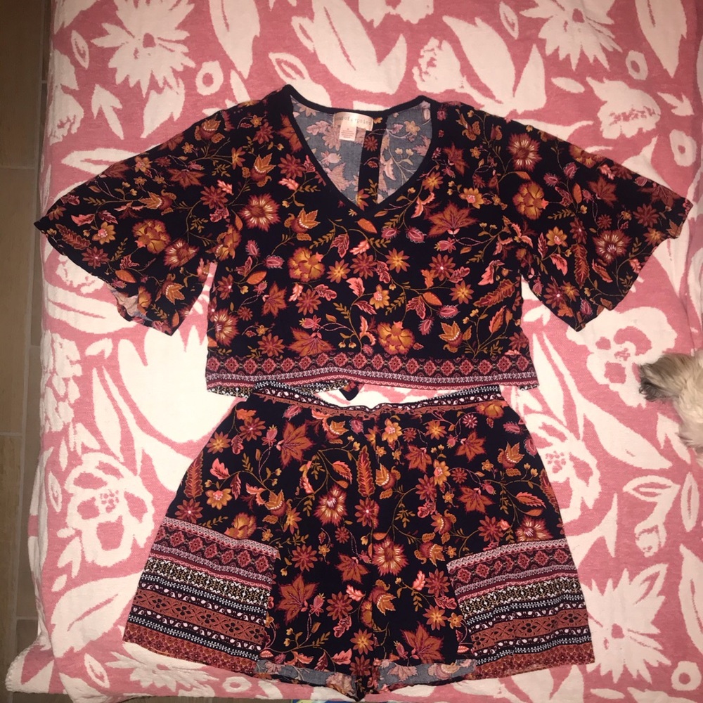Two piece, high wasted skort/ open back top.